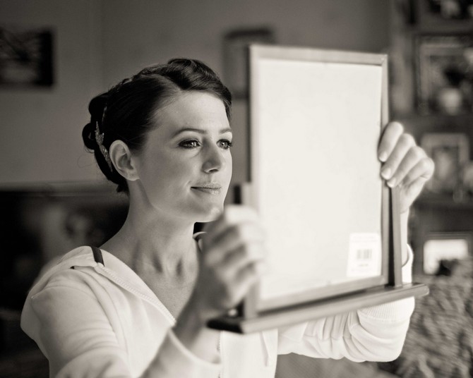 Bride putting on make-up. Real Wedding. Tara Aherne Photography. WeddingsOnline.ie bride with mirror